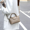 Natural Cowhide Drawstring Nine West Handbags With Bubble Pattern
